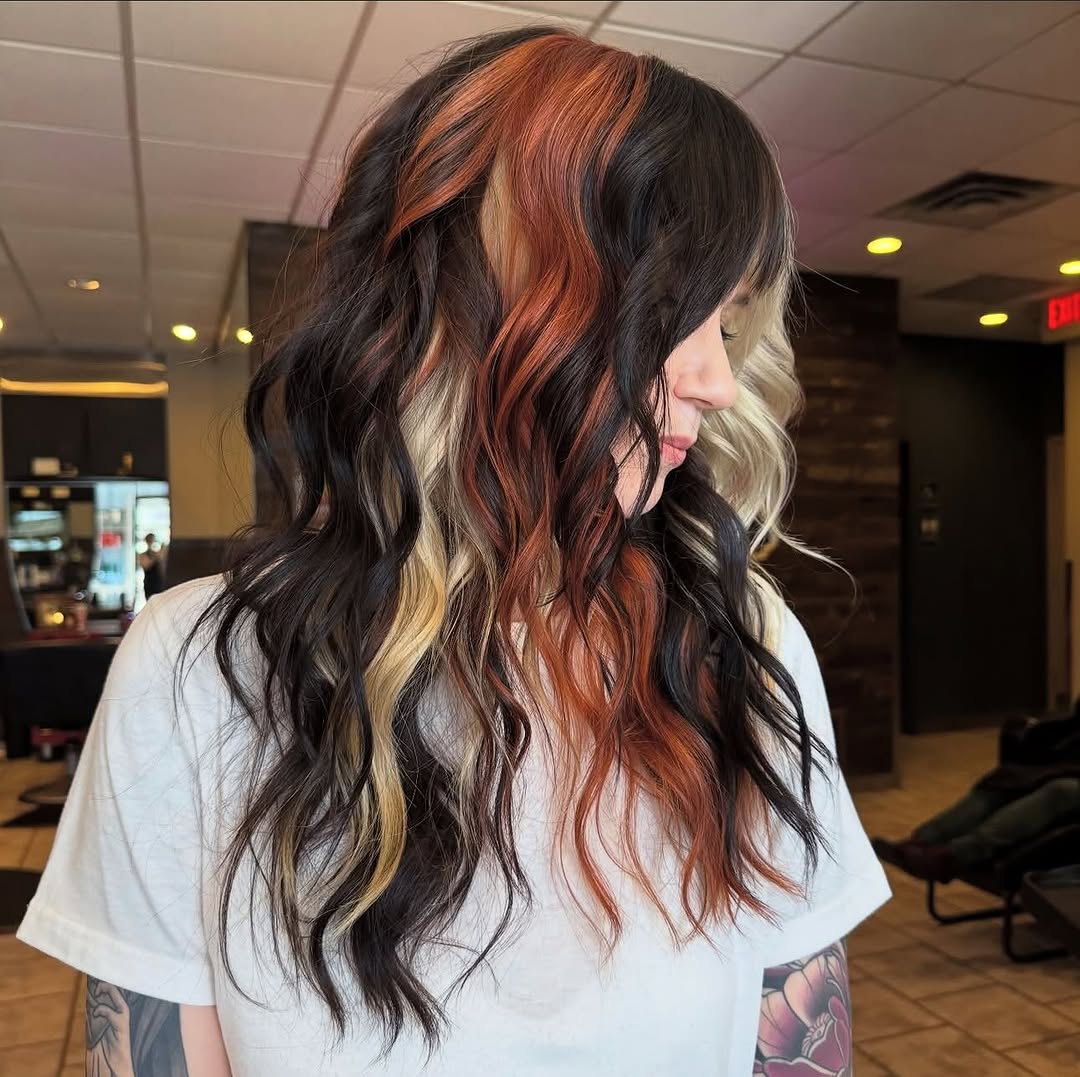 Gorgeous calico hair color on mid-length wavy hair.