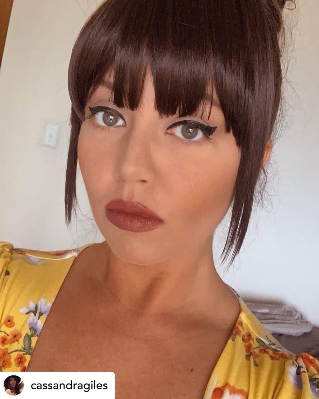 Clip-in bangs on beautiful brown hair.