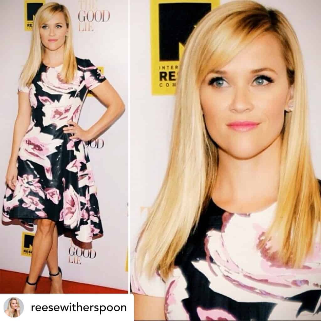Reese Witherspoon with sleek side-swept bangs.