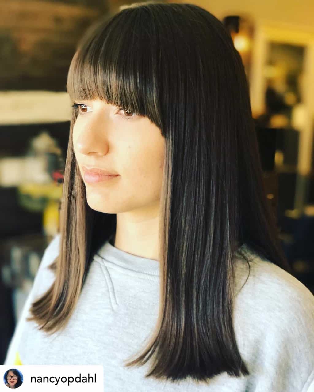 Mod bangs on beautiful brown hair.