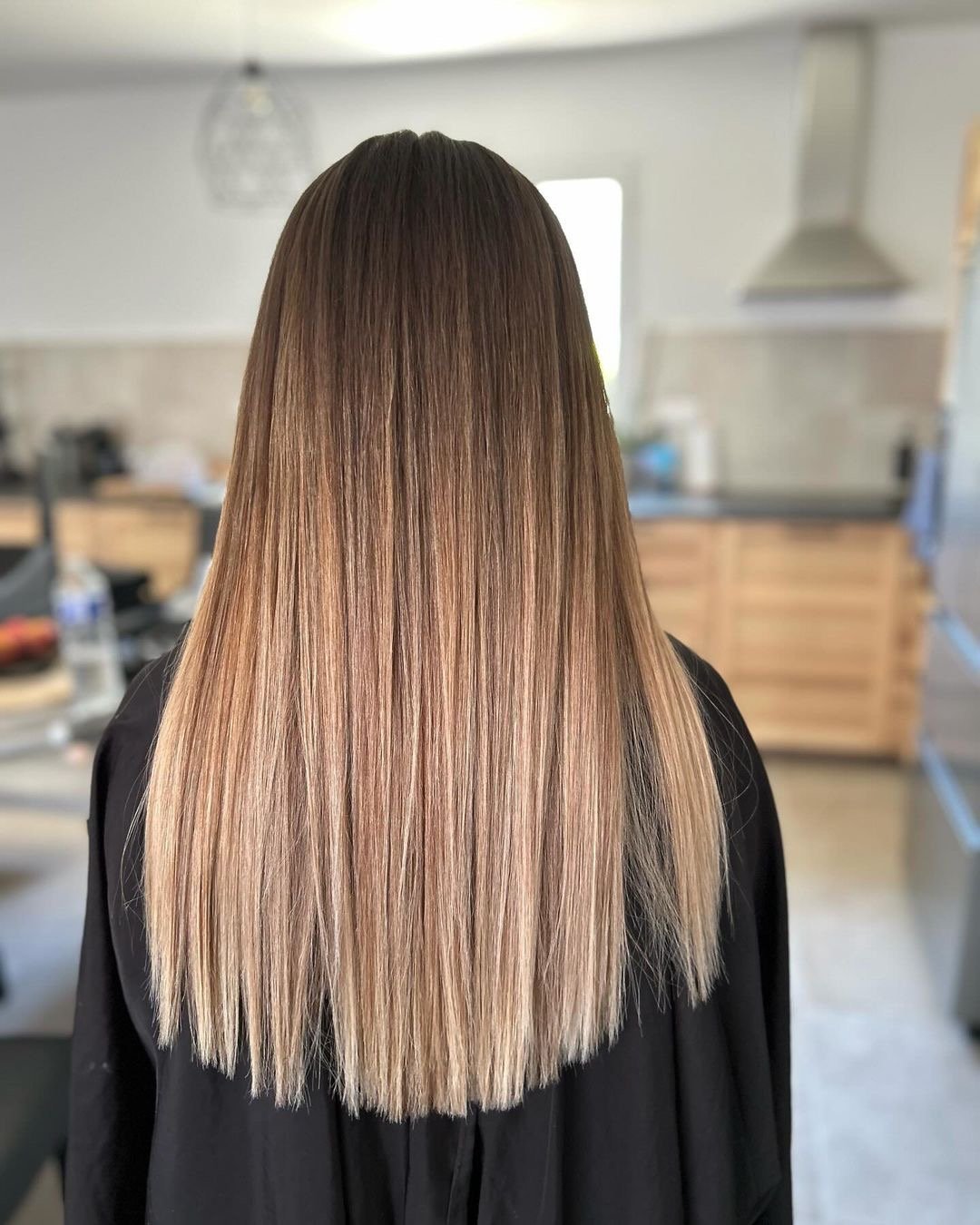 Gorgeous ombré hair color on long straight hair.