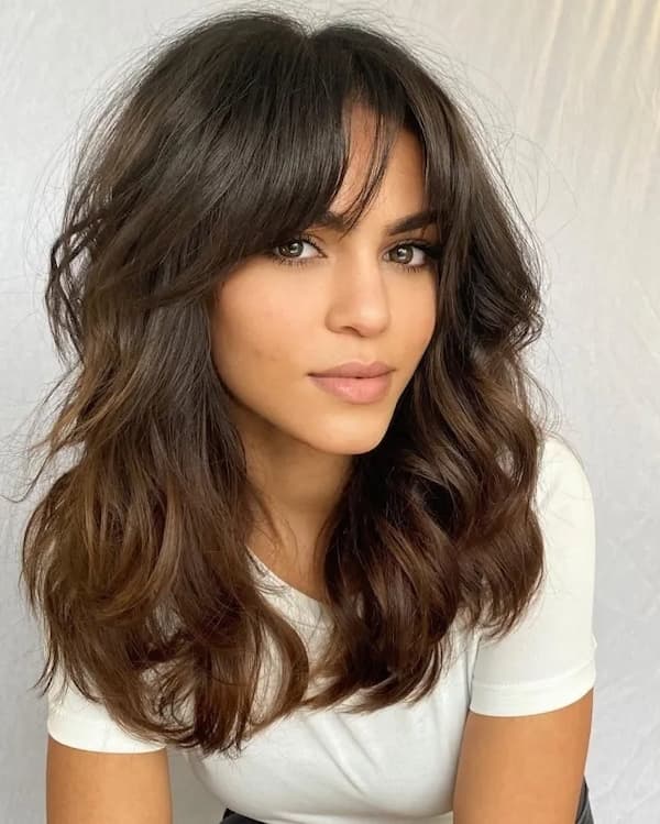 Wavy Haircut with Curtain Bangs