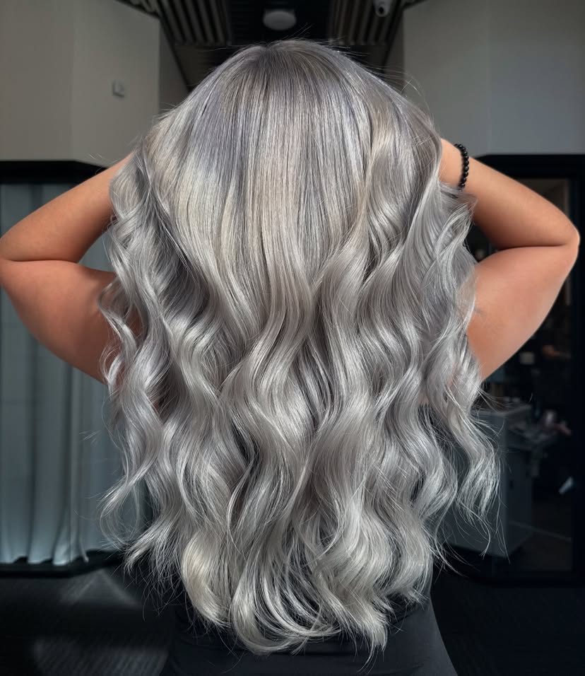 Woman with gorgeous silver hair color for winter.