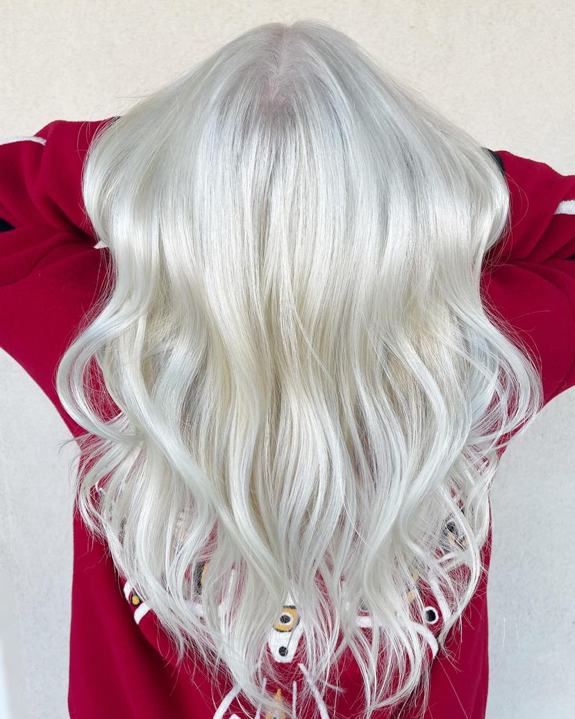 Woman with gorgeous icy platinum blonde hair color for winter.