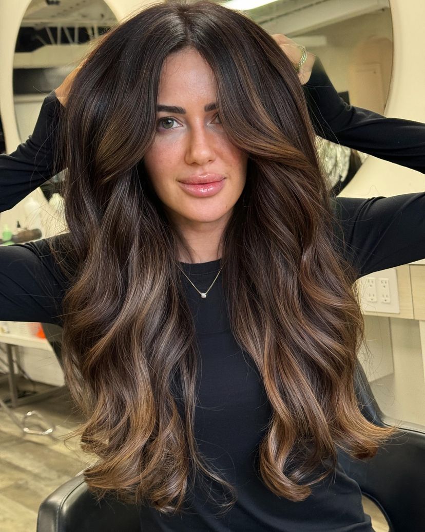 Woman with gorgeous chocolate truffle hair color for winter.