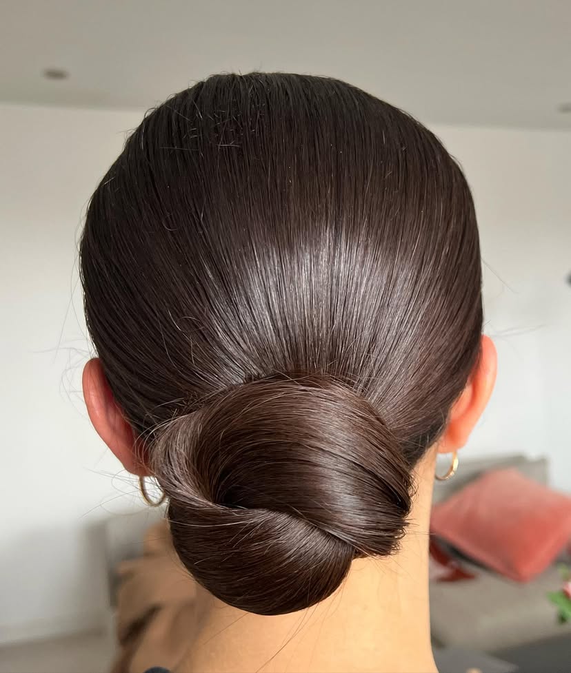 winter-hairstyles-6 Woman with beautiful sleek low bun.