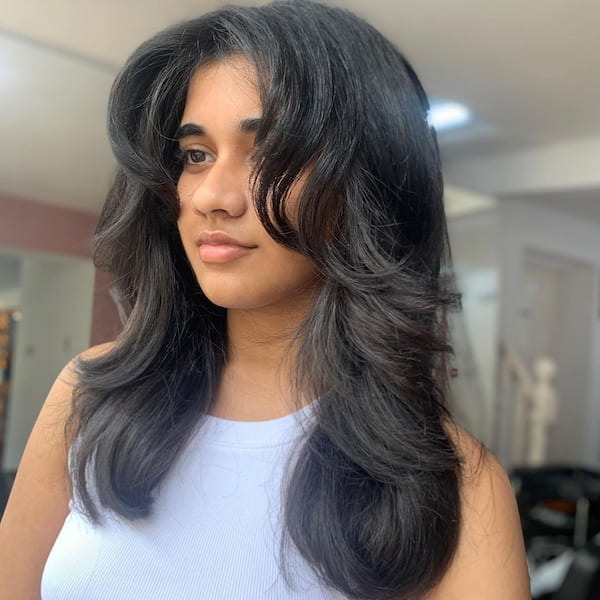 wolf-haircut-with-bouncy-curls-and-curtain-bangs Wolf Haircut with Bouncy Curls and Curtain Bangs